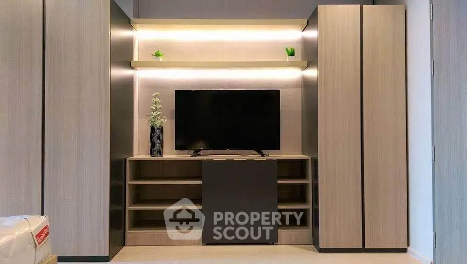 Modern living room with sleek TV unit and ambient lighting