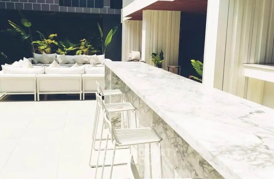 Luxurious outdoor seating area with marble bar and modern design