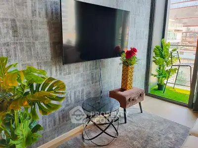 Modern living room with wall-mounted TV and stylish decor