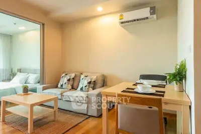 Cozy living room with modern furniture and air conditioning in a stylish apartment.