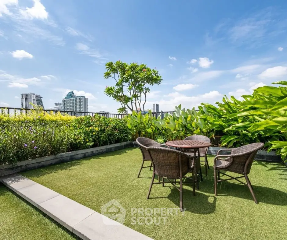 Stunning rooftop garden with city views and outdoor seating area.