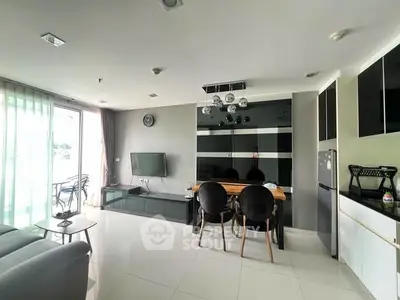Modern living room with sleek furniture and large windows in a stylish apartment.