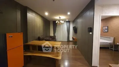 Spacious living room with wooden dining set and modern decor