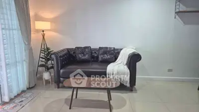 Stylish living room with leather sofa and modern decor