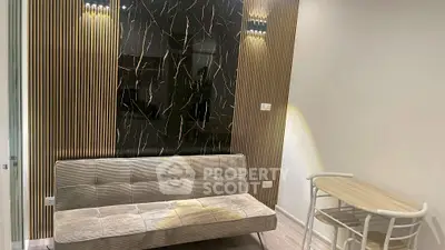 Modern living room with stylish sofa and sleek wall design, perfect for urban living.