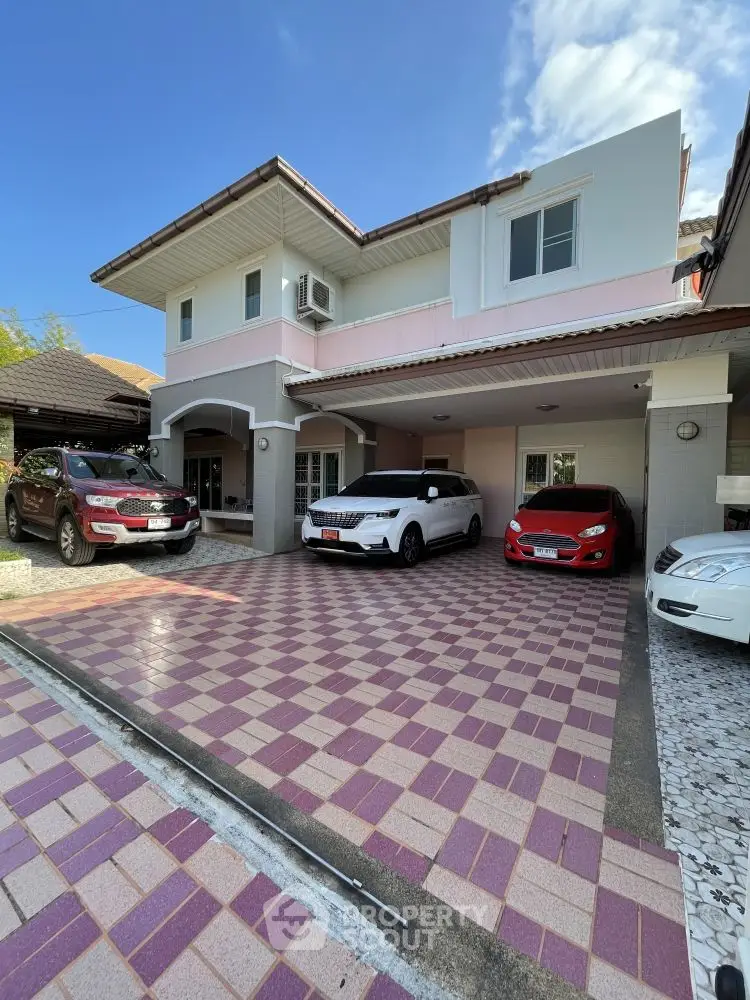 Charming two-story house with spacious driveway and multiple car parking