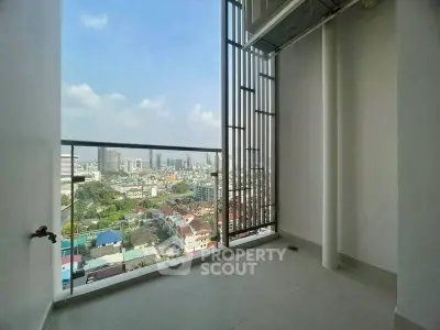 Stunning high-rise balcony with panoramic city views and modern design.