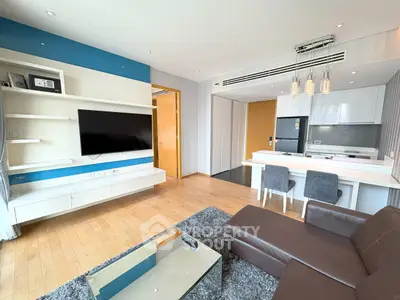 Modern living room with open kitchen and stylish decor