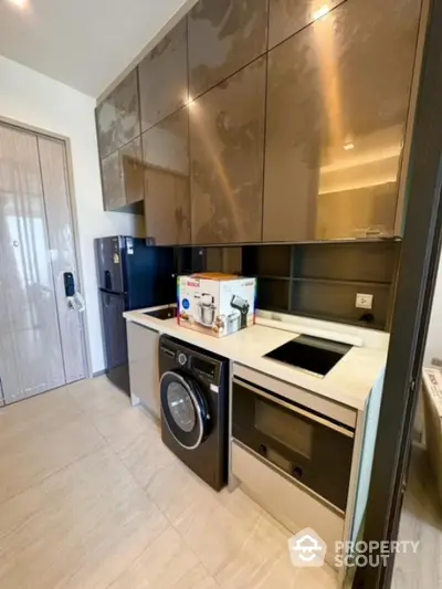 Modern kitchen with sleek cabinets and built-in appliances