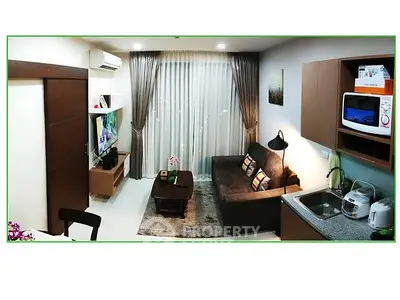 Modern compact living room with kitchenette, cozy sofa, and stylish decor