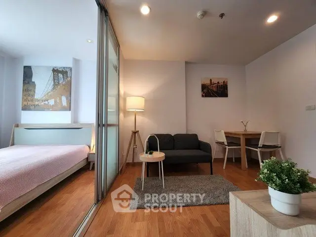 Modern studio apartment with cozy living area and stylish decor
