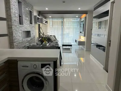 Modern living room with sleek design and built-in washing machine