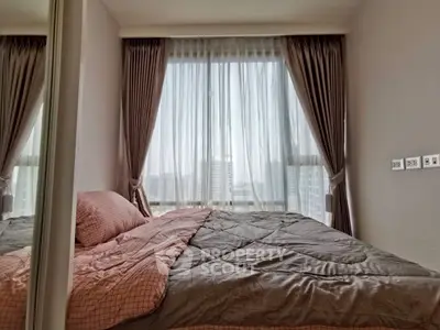 Cozy bedroom with large window offering stunning city view, elegant curtains, and stylish bedding.