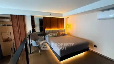 Modern bedroom with stylish lighting and cozy decor in a contemporary apartment.