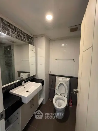 Modern bathroom with sleek fixtures and stylish tile accents