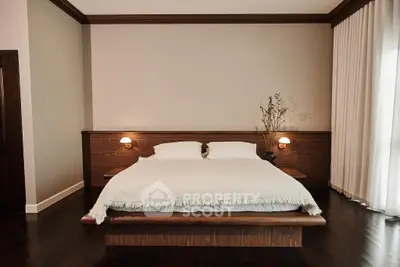 Luxurious bedroom with elegant wooden bed and soft lighting