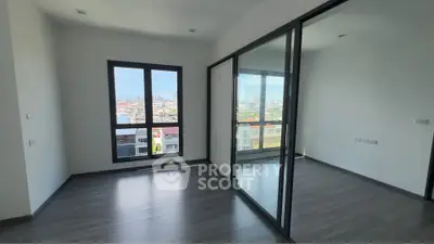 Spacious modern apartment with large windows and city view