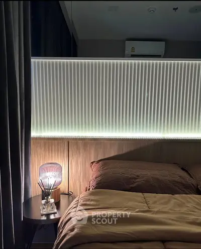 Cozy bedroom with modern lighting and elegant decor