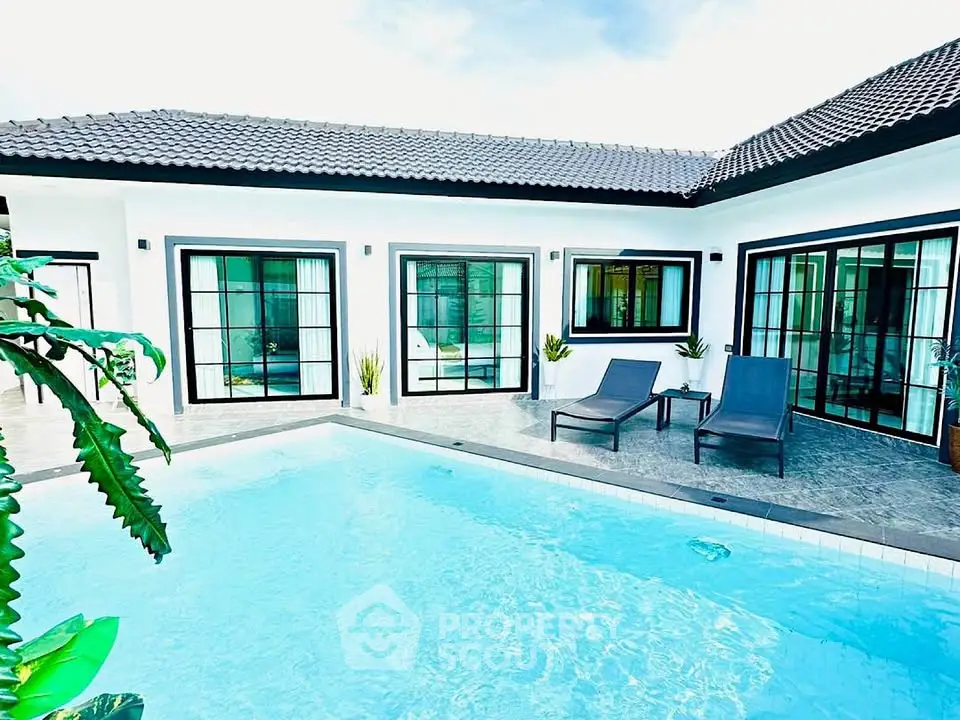 Luxurious modern villa with private pool and elegant patio area, perfect for relaxation and entertaining.