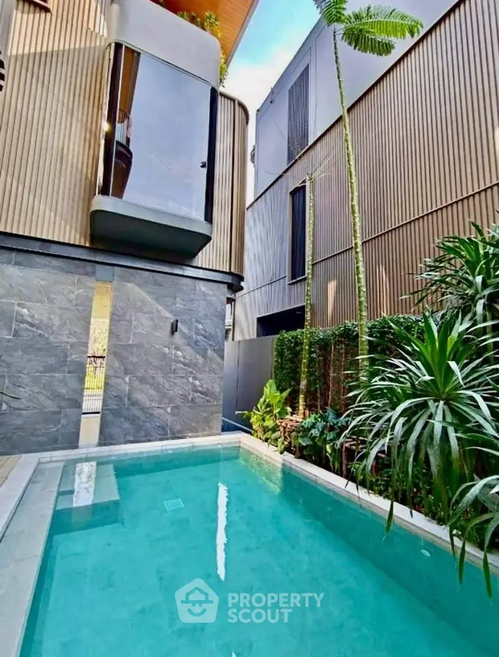 Luxurious modern home with private pool and sleek architectural design.