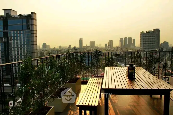 Stunning rooftop terrace with panoramic city skyline views, perfect for relaxation and entertainment.