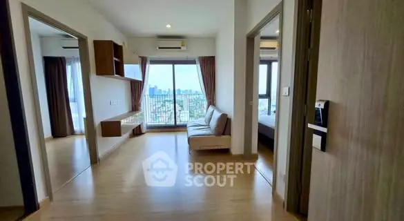 Spacious modern living room with city view and balcony access