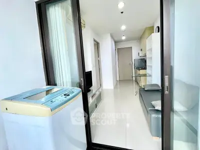 Modern apartment interior with washing machine and sleek living area