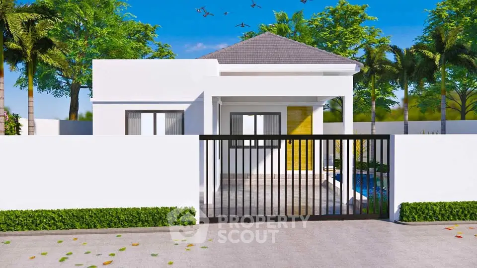 Modern single-story home with sleek design and gated entrance, surrounded by lush greenery and clear blue sky.