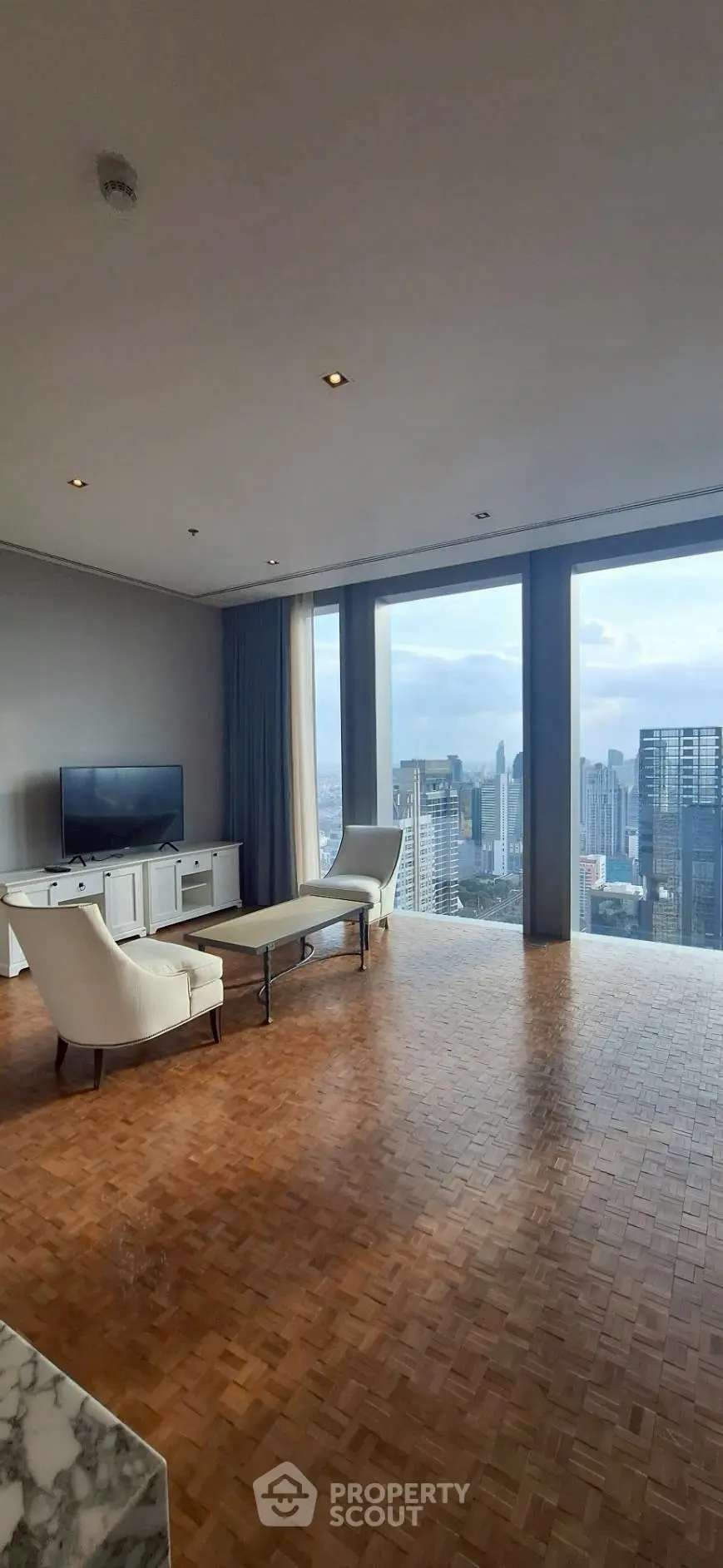 Luxurious living room with panoramic city view and elegant furnishings