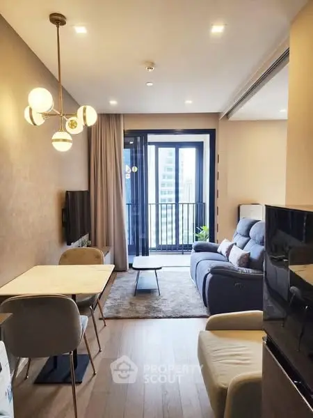 Modern living room with stylish decor and balcony view
