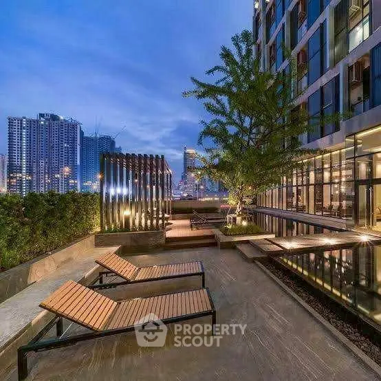 Luxurious rooftop terrace with stunning city views and modern lounge chairs.