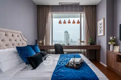 Luxurious bedroom with city view, elegant decor, and stylish furnishings.