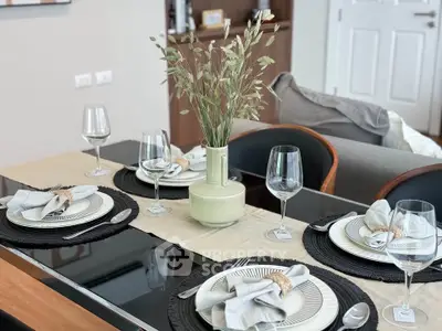 Elegant dining table setup with modern decor in a stylish living space.