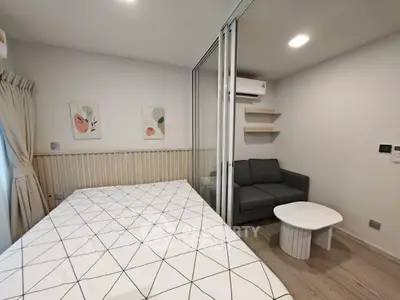 Modern studio apartment with cozy living area and stylish decor