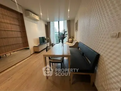 Modern living room with stylish decor and large window view