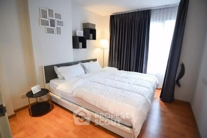 Modern bedroom with stylish decor and natural light