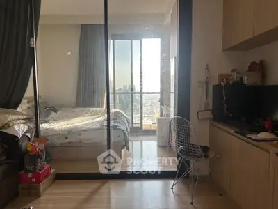 Modern bedroom with balcony view in high-rise apartment