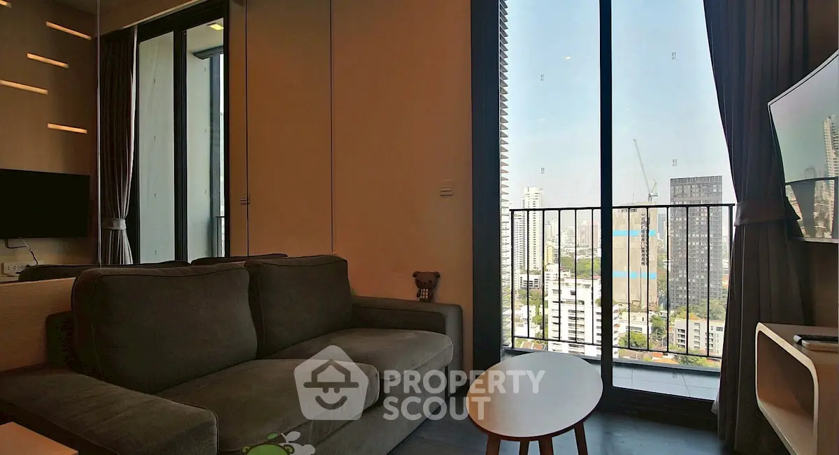 Modern living room with city view and cozy sofa in high-rise apartment