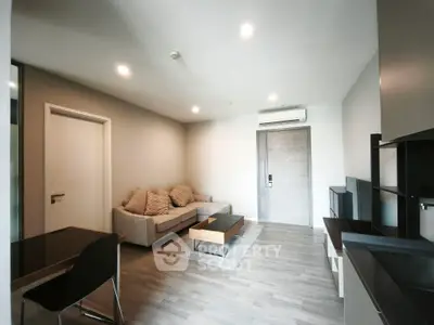 Modern living room with cozy sofa and sleek furniture in a stylish apartment.