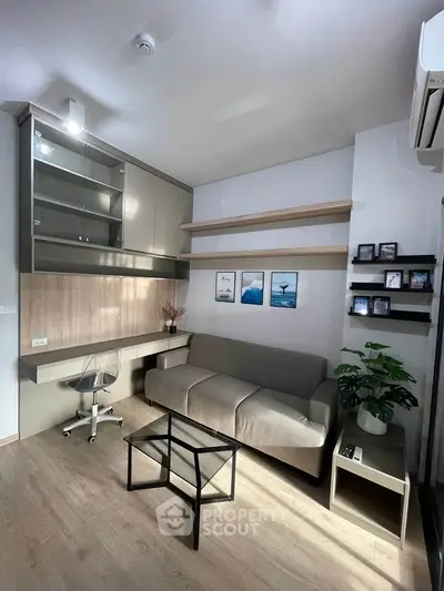 Modern living room with sleek furniture and stylish decor, featuring a cozy sofa and wall-mounted shelves.