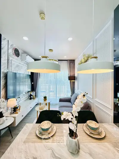 Luxurious modern living room with elegant decor and large windows for natural light.