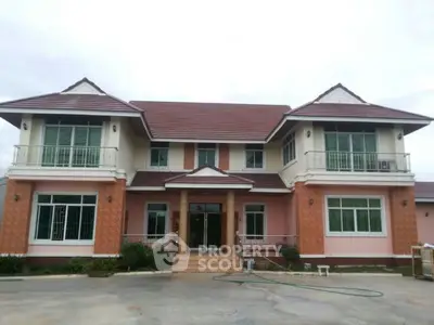 Stunning two-story house with elegant balconies and spacious driveway