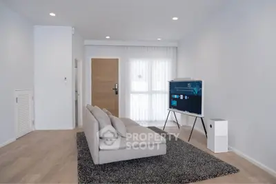 Modern living room with sleek furniture and natural light