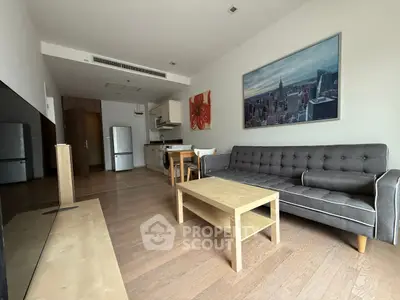 Modern living room with open kitchen and stylish decor