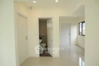 Spacious modern apartment interior with sleek design and ample natural light
