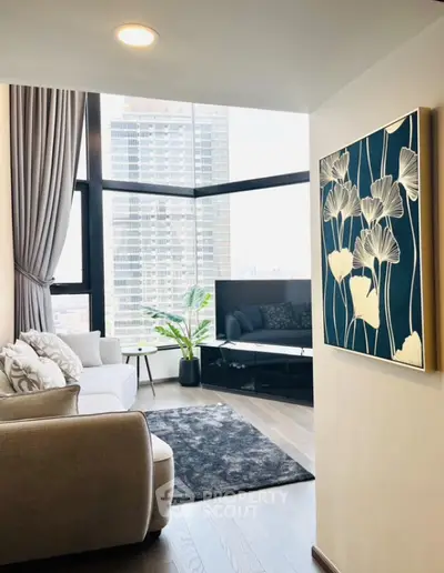 Modern living room with large windows and city view, stylish decor and cozy seating area.