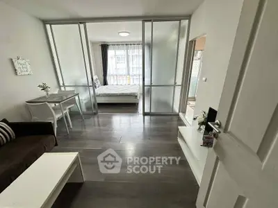 Modern studio apartment with sliding glass doors and stylish decor