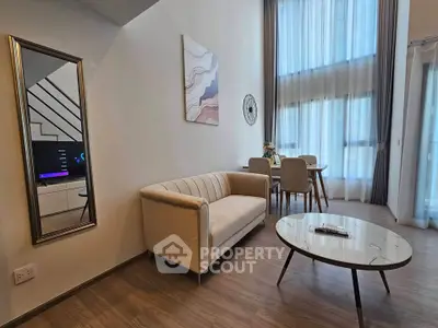 Modern living room with high ceilings and elegant decor