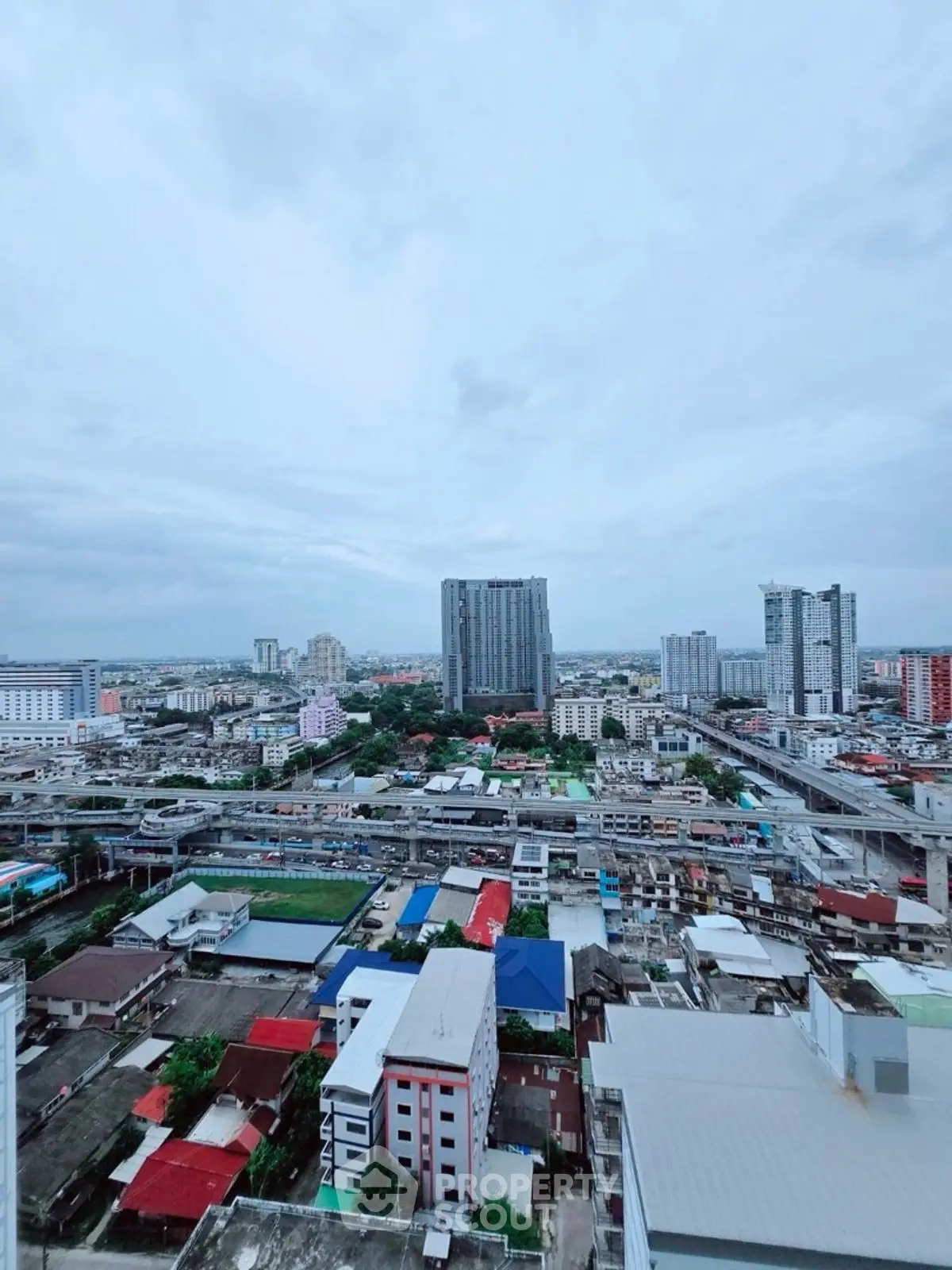 Stunning cityscape view from high-rise building showcasing urban skyline and vibrant architecture.