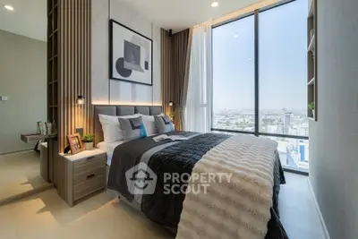 Luxurious bedroom with floor-to-ceiling windows and stunning city view